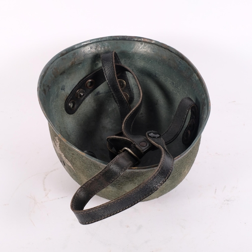 44 - A reproduction German World War II Paratrooper's helmet, with leather strap