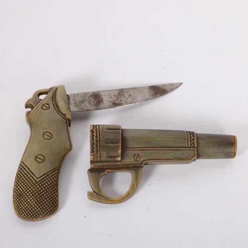 473 - A Vintage novelty carved horn 'Revolver' knife, the removable barrel concealing internal blade, blad... 