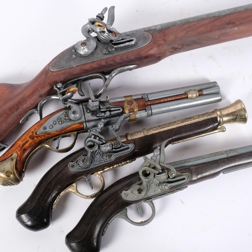 53 - A group of modern reproduction weapons, including 3 flintlock type pistols and a blunderbuss