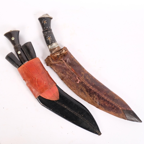 54 - 2 Nepalese kukri knives and scabbards