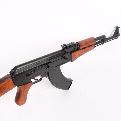 59 - A Denix, (Made in Spain) replica copy of a Russian AK-47 assault rifle with magazine, L87cm