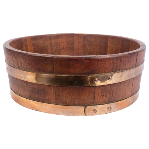 64 - A coopered oak half barrel/jardiniere stand, diameter 45cm, height 16cm