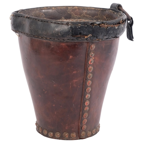 65 - A 19th century studded leather fire bucket (lacking handle), height 27cm