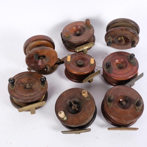 79 - A collection of Vintage wooden Starback and other fishing reels, widest 4