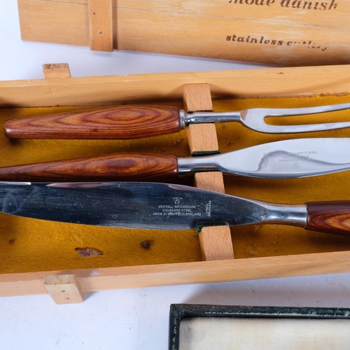 535 - A modernist stainless steel 'Mode Danish' carving set, by Westall Richardson, and another carving se... 