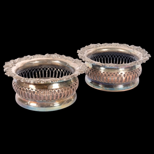 538 - A pair of silver plated oak wine bottle coasters, internal diameter 12cm