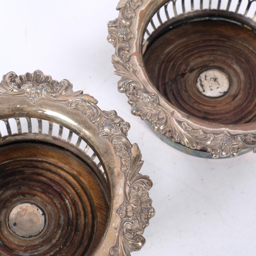 538 - A pair of silver plated oak wine bottle coasters, internal diameter 12cm