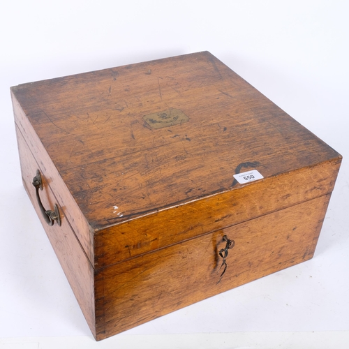 550 - An Antique oak tea set case, with brass inset armorial plaque