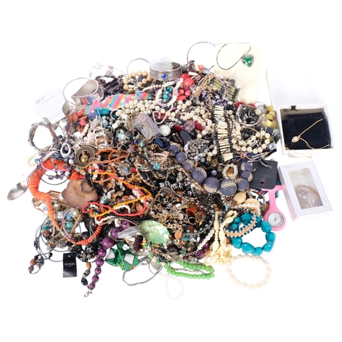 555 - A large quantity of costume jewellery, including bead necklaces, bracelets, etc