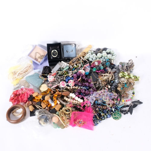 555 - A large quantity of costume jewellery, including bead necklaces, bracelets, etc