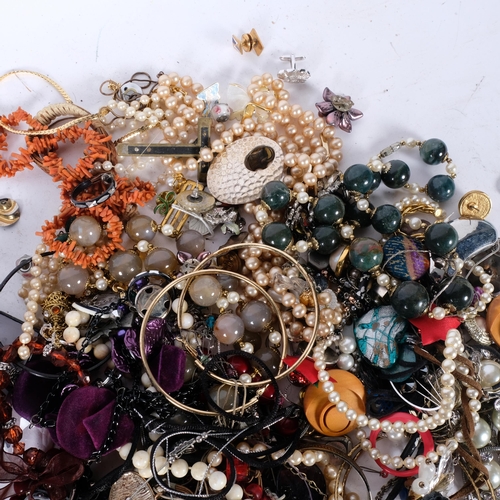 557 - Various costume jewellery, including silver marcasite wristwatch, bead necklaces, coral, etc