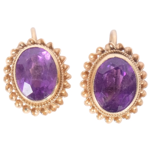 565 - A pair of 9ct gold amethyst earrings, with screw-back fittings, 2.7g