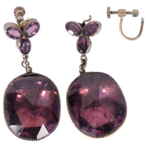 569 - A pair of Georgian foil-back amethyst drop earrings, cut-down collet set with oval rose-cut amethyst... 