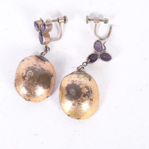 569 - A pair of Georgian foil-back amethyst drop earrings, cut-down collet set with oval rose-cut amethyst... 