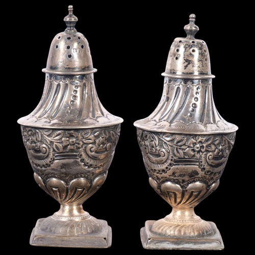 585 - A pair of Victorian silver baluster pepperettes, Josiah Williams & Co, London 1895, 10cm, 3.8oz tota... 