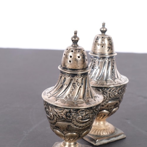 585 - A pair of Victorian silver baluster pepperettes, Josiah Williams & Co, London 1895, 10cm, 3.8oz tota... 