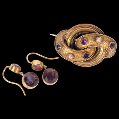 609 - A pair of 15ct gold and amethyst set pendant earrings, 2.9g, and an unmarked gold knot design brooch... 