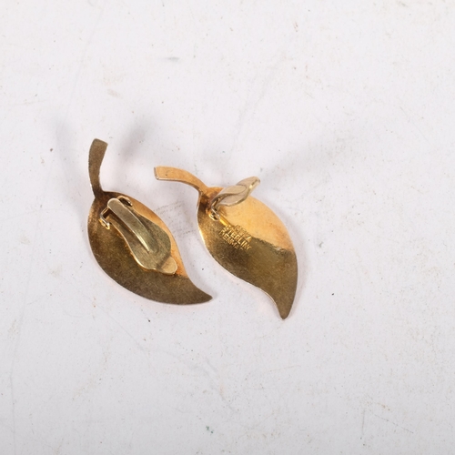 628 - MEKA - a pair of Danish modernist sterling silver-gilt white enamel leaf clip-on earrings, 32mm, 5.3... 