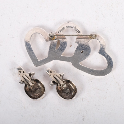 629 - A pair of Mexican sterling silver earrings, and a Mexican silver integrated 3-heart design brooch