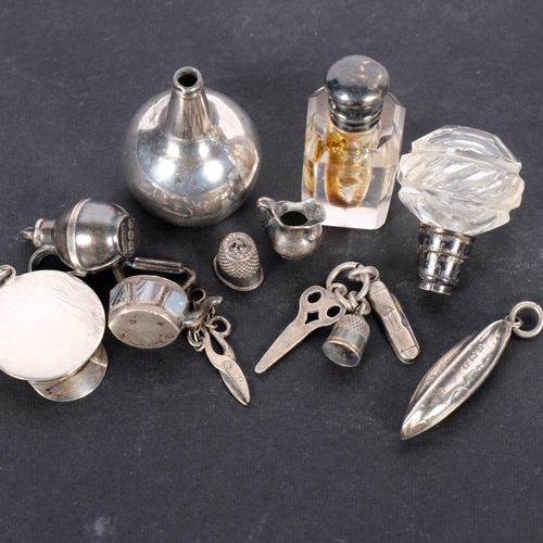 638 - A group of miniature silver charms, scent bottle, etc, charms in the form of a agate set kettle, thi... 