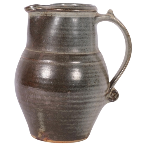 653 - A glazed Studio jug from the Leach Pottery, H20cm