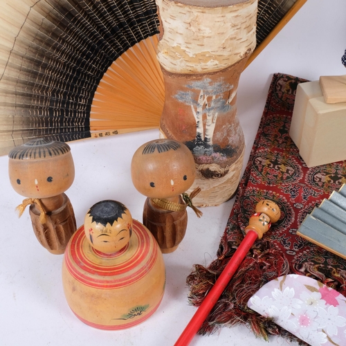 667 - Japanese Kokeshi dolls, tallest 29cm, Japanese fans, etc