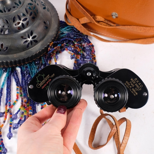 668 - Greenkat 8x40 binoculars, cased, and a pierced metal lamp shade with beaded drops, diameter 18cm