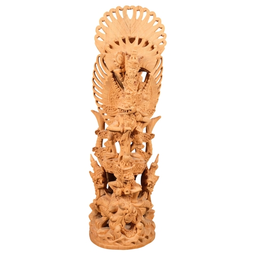 679 - A highly detailed Balinese carved wood figural group sculpture of Vishnu and Garuda, 45cm