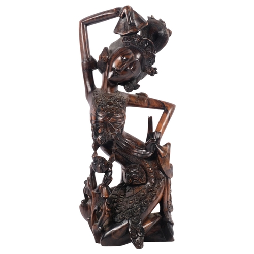 681 - An impressive Balinese Art Deco carved wood figure of a dancer, circa 1930s, 42.5cm