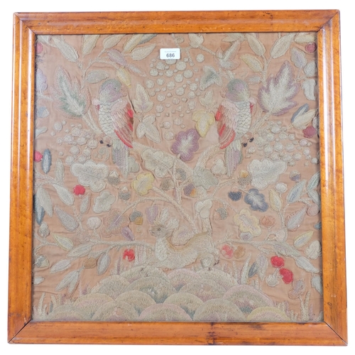 686 - An Antique maple-framed embroidered crewelwork panel, depicting parrots and flowers, 64cm x 64cm