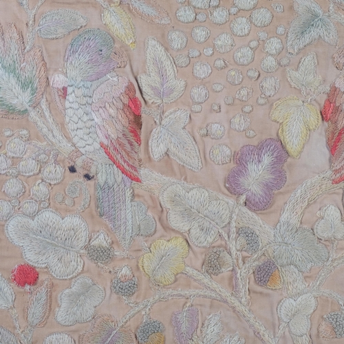 686 - An Antique maple-framed embroidered crewelwork panel, depicting parrots and flowers, 64cm x 64cm