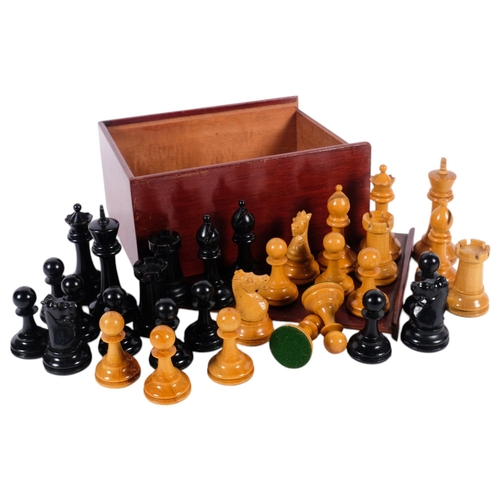 715 - A turned wood chess set, King height 8.5cm, boxed