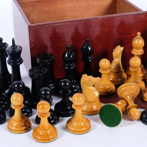 715 - A turned wood chess set, King height 8.5cm, boxed