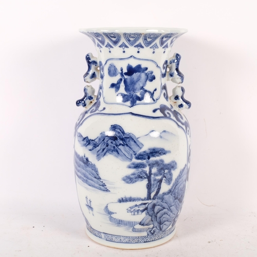 721 - A Chinese porcelain blue and white vase, with garden and lake scenes, 36.5cm