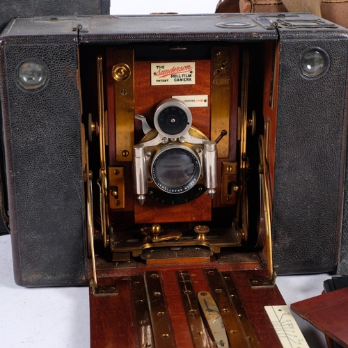 730 - An Edwardian Sanderson mahogany and brass roll film camera, with plates, 21.5cm across