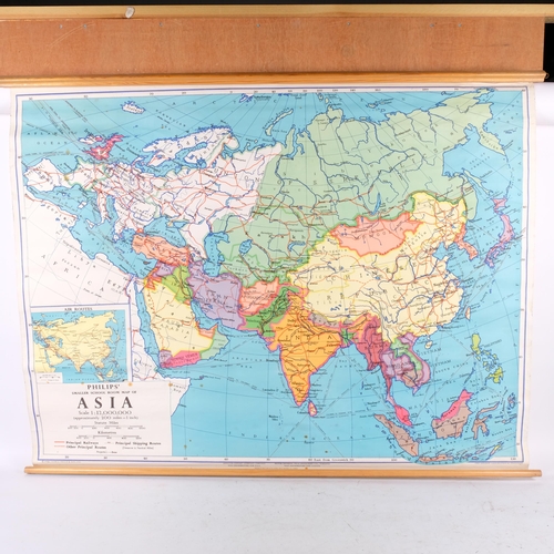 734 - A Philip's wall map of Europe, 112cm across, another of Asia, and a George Philips school room map o... 