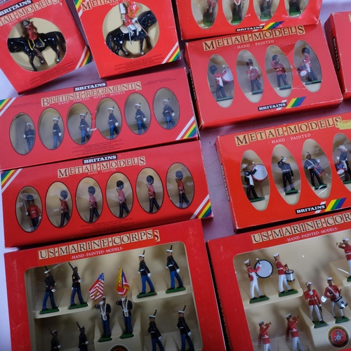 769 - A collection of boxed hand painted Britains military figures, including United States Marine Corps m... 