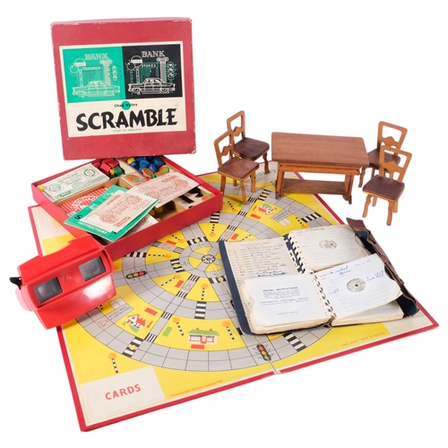 866 - A viewmaster and slides, a Chad Valley Scrambled game, and a large scale doll's house table and chai... 