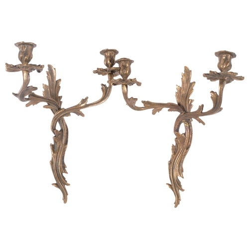 885 - A pair of heavy gilt-metal foliate design wall lights, 37cm