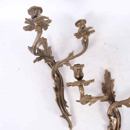 885 - A pair of heavy gilt-metal foliate design wall lights, 37cm