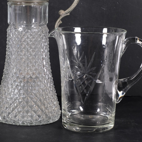 895 - 3 moulded glass Claret jugs with plated mounts, tallest 35cm, and a cut-glass water jug