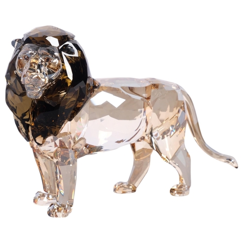 952 - SWAROVSKI - a tinted model of Akili The Lion, H12cm, boxed