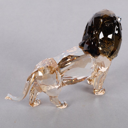 952 - SWAROVSKI - a tinted model of Akili The Lion, H12cm, boxed