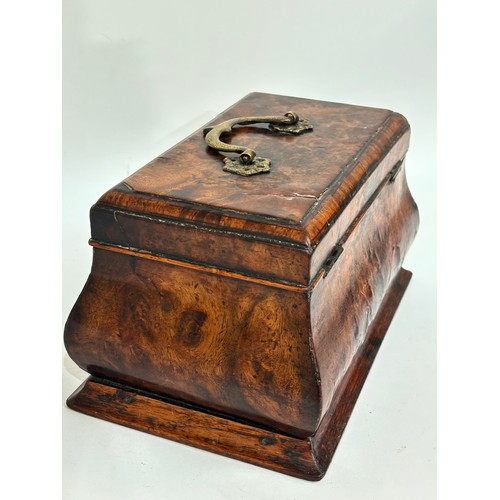 13 - A Georgian walnut caddy, with 3-sectional interior, ogee shaped form with brass swing handle, W24cm