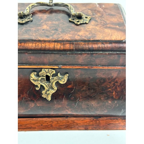 13 - A Georgian walnut caddy, with 3-sectional interior, ogee shaped form with brass swing handle, W24cm