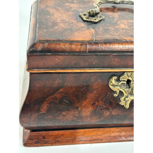 13 - A Georgian walnut caddy, with 3-sectional interior, ogee shaped form with brass swing handle, W24cm