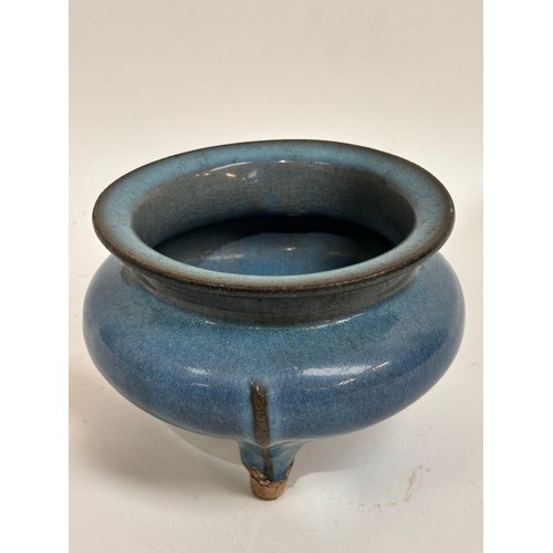 902 - A Chinese stoneware glazed pot on 3 feet, 15cm across