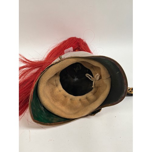 43 - A Household Cavalry Royal Horse Guards Officer's helmet, with red plume, applied brass laurel wreath... 