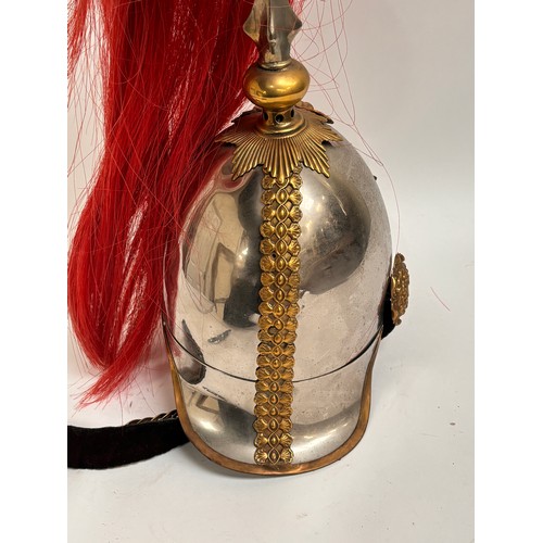 43 - A Household Cavalry Royal Horse Guards Officer's helmet, with red plume, applied brass laurel wreath... 