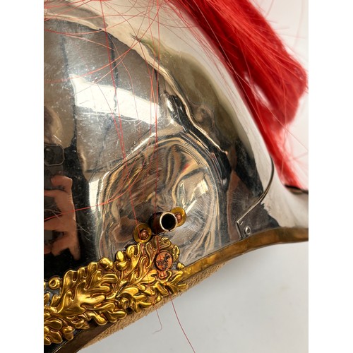 43 - A Household Cavalry Royal Horse Guards Officer's helmet, with red plume, applied brass laurel wreath... 